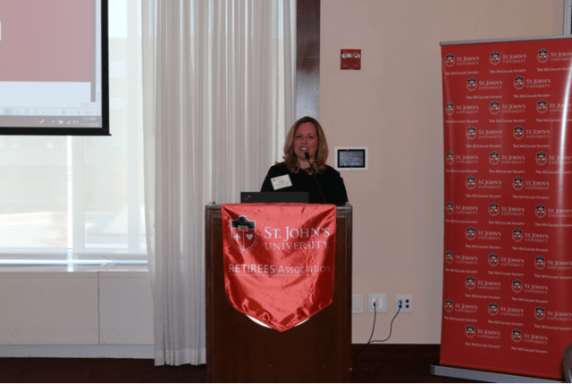 Susan Damiani speaking at podium