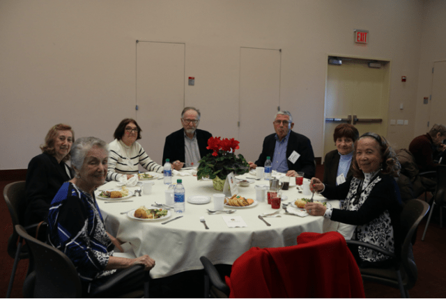 2020 Retiree Association guests enjoying food at a round table