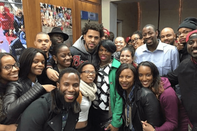 Black Alumni Association Members posing for photo with J Cole