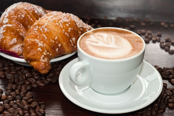cup of cappuccino and 2 pastries