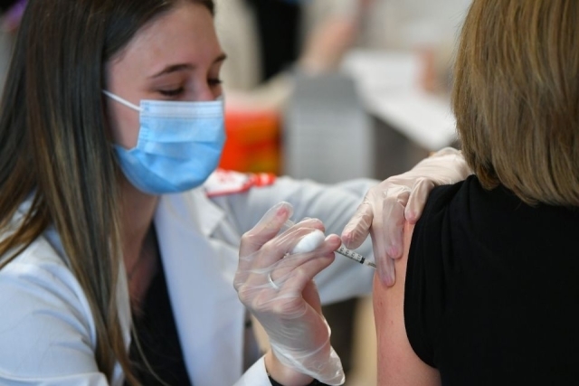 Pharmacy student vaccinates St john's employee
