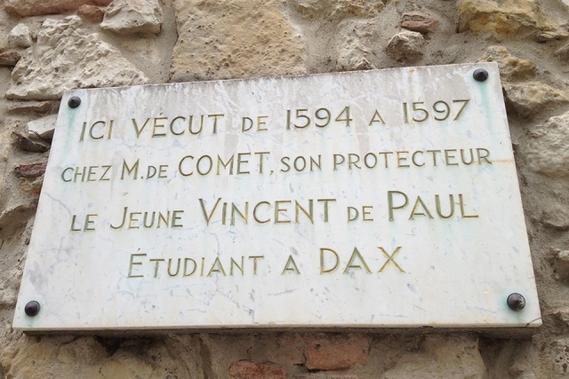 Engraved sculpture sign with statement about St. Vincent de Paul