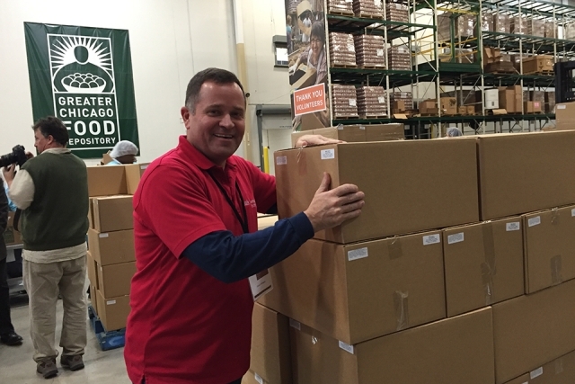 St. John's Vincentian Mission Institute member moving cart of boxes