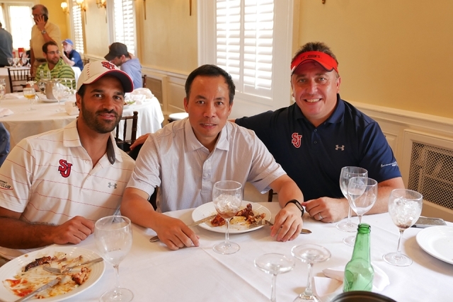 Paul Sclafani, St. John's alum and Mark Andrews smile for a photo