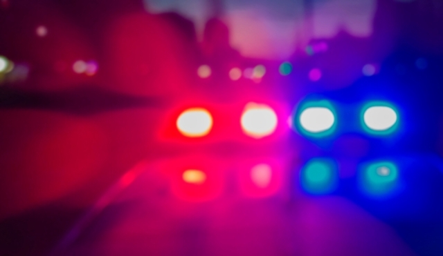 police car lights blurred in red white and blue