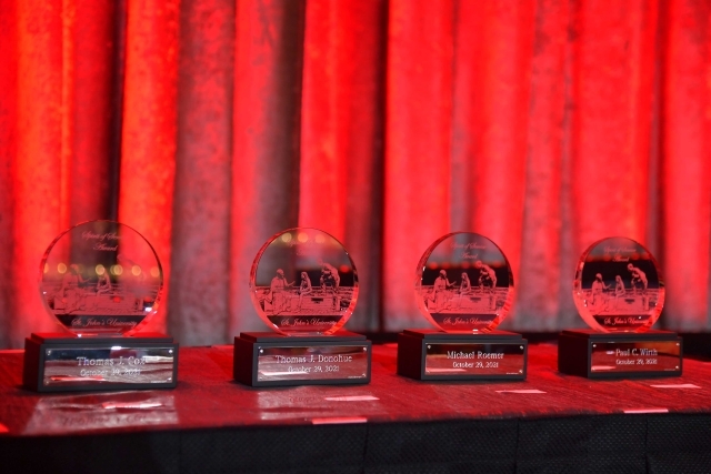 4 awards sitting on table 