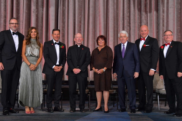 Group of adults posing for photo