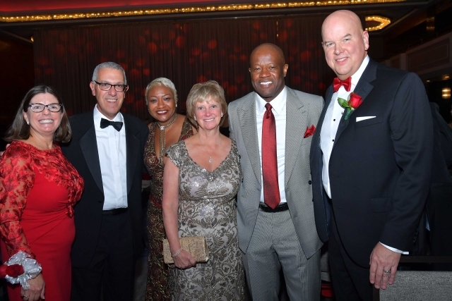 Group shot of adults posing for photo