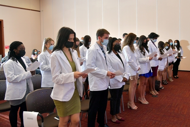 Radiologic Sciences students standing at their seats