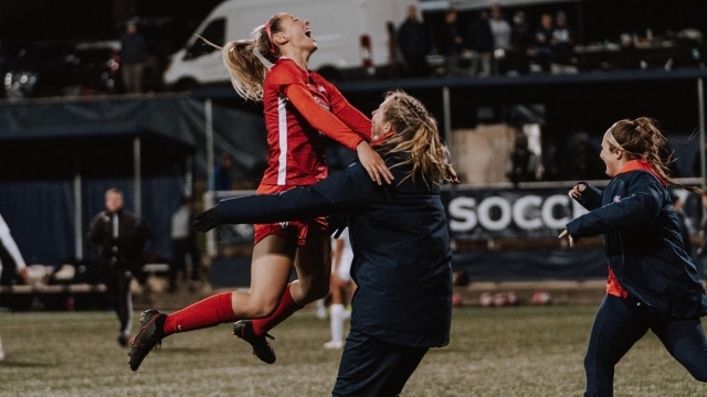 Female Soccer Players Celebrating on Field