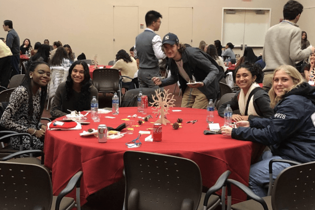 Catholic Scholars Thanksgiving dinner participants at at table