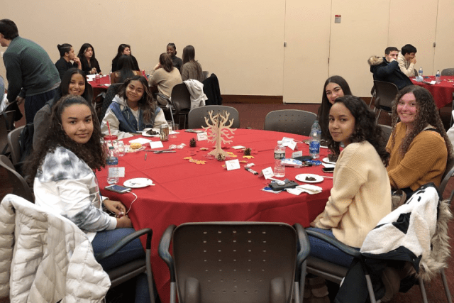 Catholic Scholars Thanksgiving dinner participants at at table