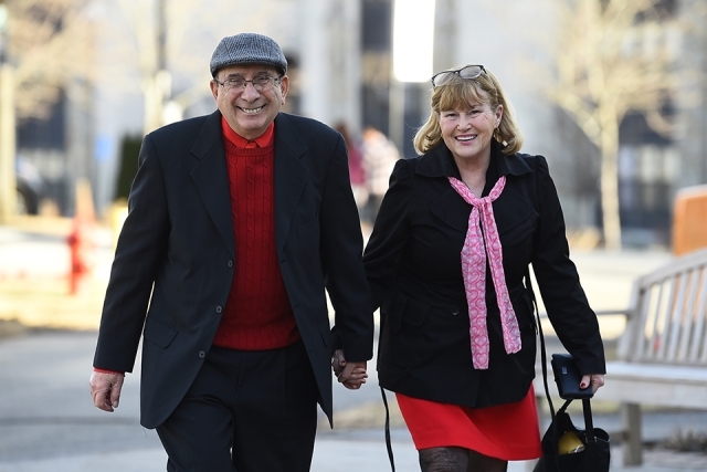 Alumni couple walking together on campus
