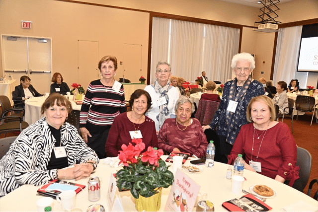 St. John's retirees seated around a table