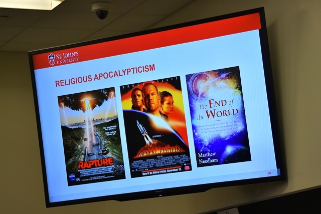 Picture of projector screen displaying "Religious Apocalypticism" and movie and book covers