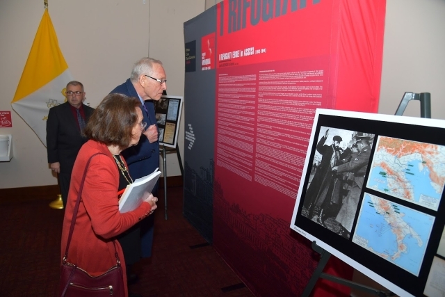 Patrons learn the story of the efforts of Assisi, Italy, citizens to protect Jews from the German occupation of Italy from 1943 to 1944.         