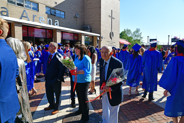 St. Francis Preparatory School graduates and family members gather outside of Carnesecca arena