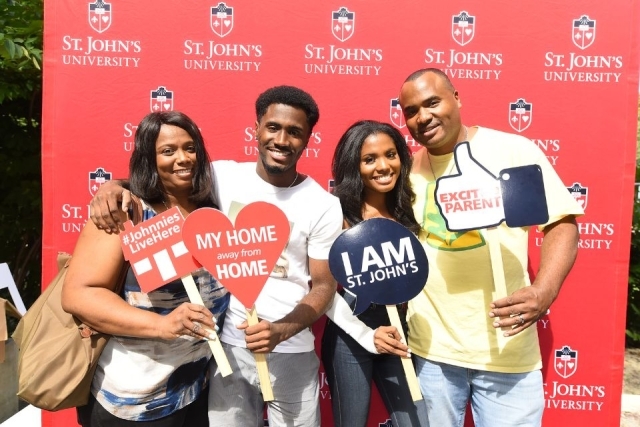 The family of a St. John's University student pose for a picture at a Family Weekend celebration
