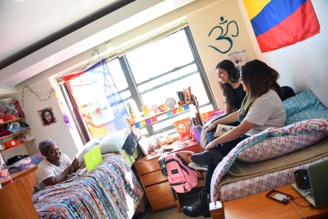 St. John's University students enjoy campus life in their dorm room.