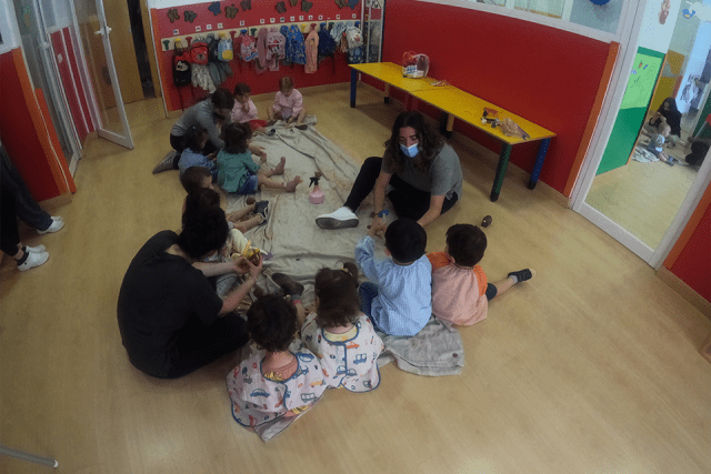 A Speech-Language Pathology student teaches a group of children in a classroom