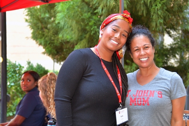 Student and family member pose for a photo