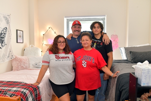 Student and family members in her dorm