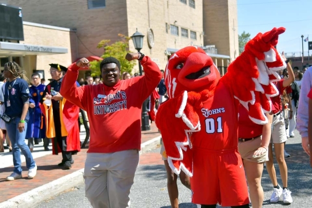 Johnny Thunderbird and student at 2022 New Student Convocation