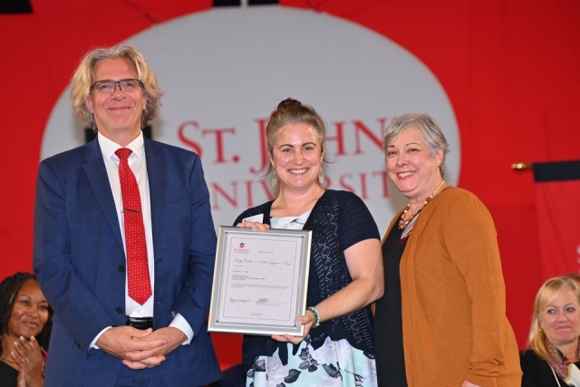 University employees pose for a photo