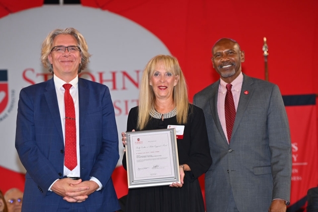 University employees pose for a photo