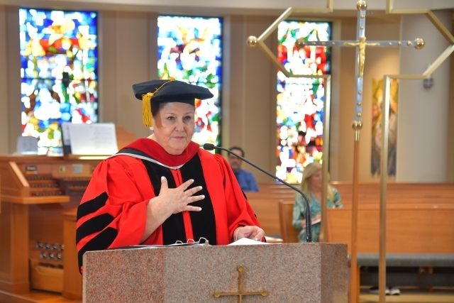Female talking at podium in church 