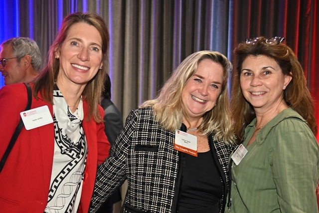 Group of three female posing for photo at Loughlin Society Winter Reception 