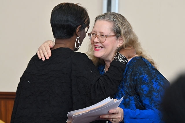 Patricia Smith embraces woman smiling