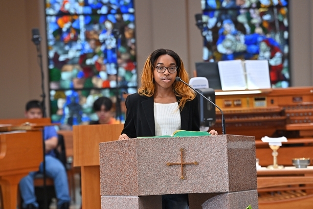 Female speaking at Mass
