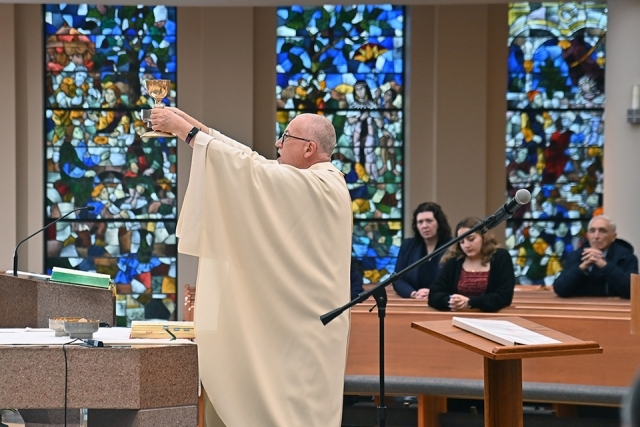 Fr. Rooney at Mass