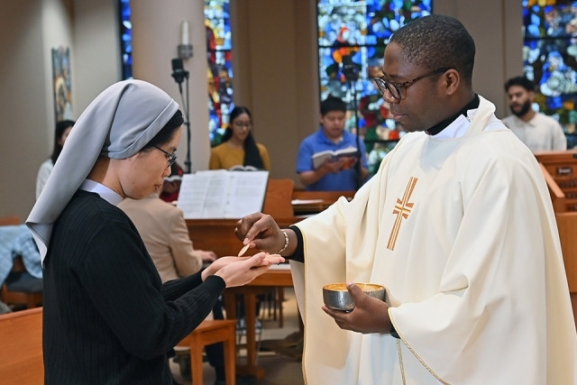 Person receiving the Eucharist