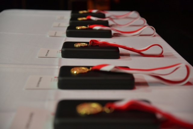 St. John's Law Belson medals set out on a table 