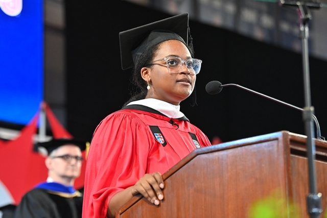 Woman speaking at podium at New Student Convocation