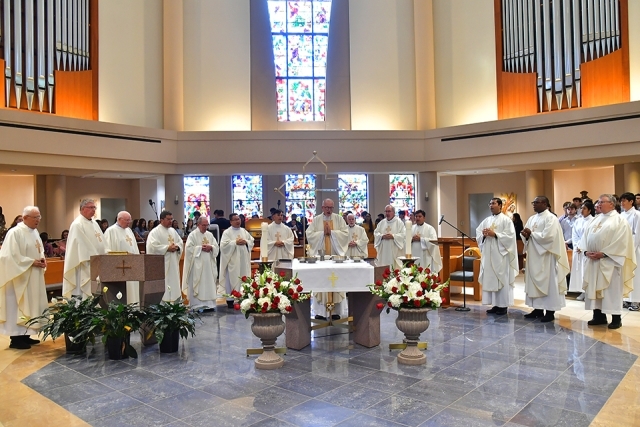 Priests at St. John's St. Thomas More Church standing together