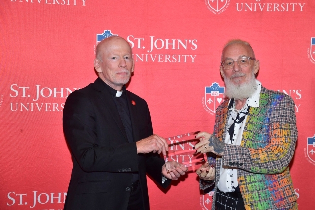 Fr. Shanley handing award to 2024 Training and Development Certificate Graduate