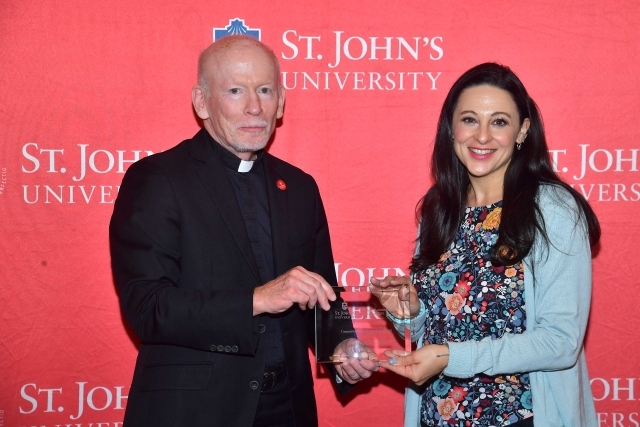 Fr. Shanley handing award to 2024 Training and Development Certificate Graduate