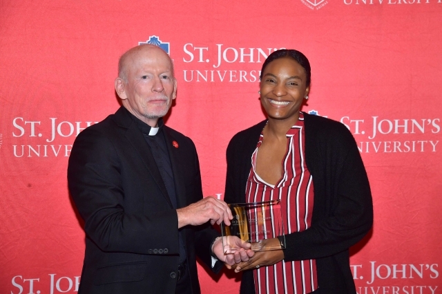 Fr. Shanley handing award to 2024 Training and Development Certificate Graduate