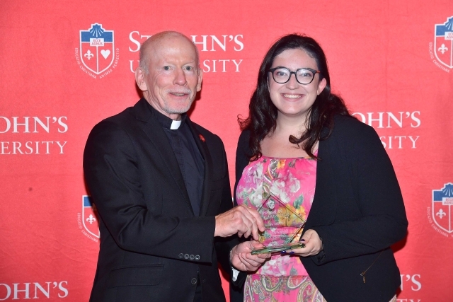 Fr. Shanley handing award to 2024 Training and Development Certificate Graduate