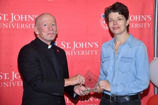 Fr. Shanley handing award to 2024 Training and Development Certificate Graduate