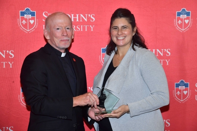 Fr. Shanley handing award to 2024 Training and Development Certificate Graduate