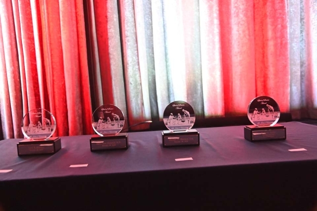 4 crystal awards sitting on table at the St. John's Presidents Dinner 