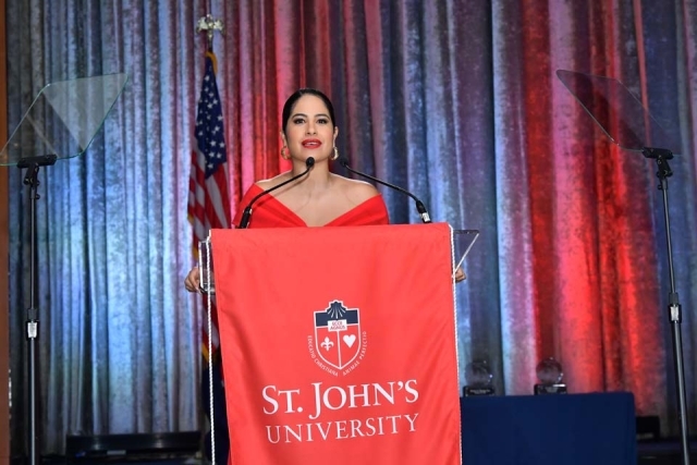 Female at podium speaking during the St. John's University President's Dinner
