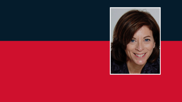 Julie Landy Headshot on a red and blue background
