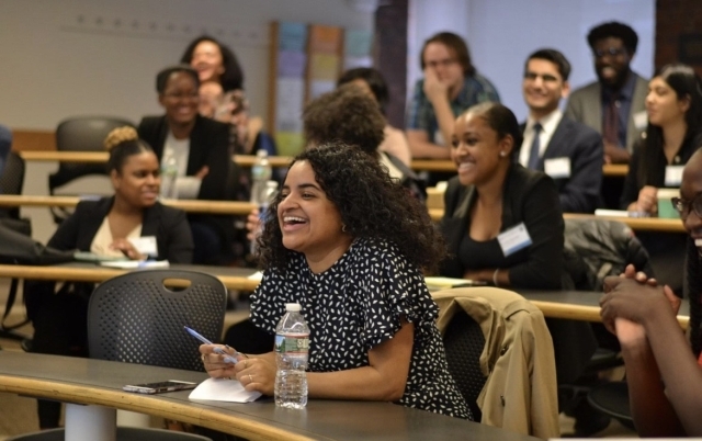 Group of students interacting in a classroom settin