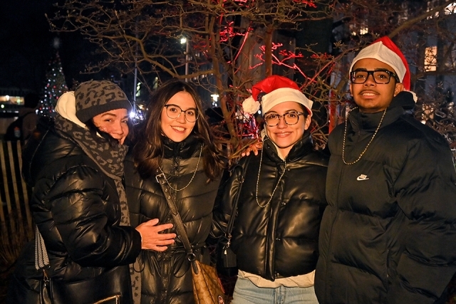 Four St. John's Students in Santa Hats at the Winter Carnival celebration