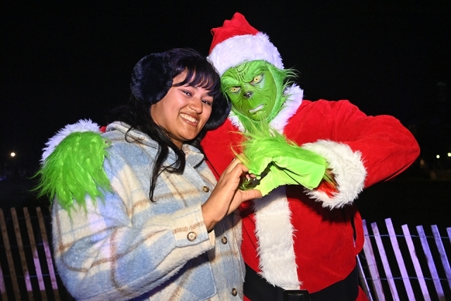 A group of students posing for a photo at the St. John's Christmas tree lighting 